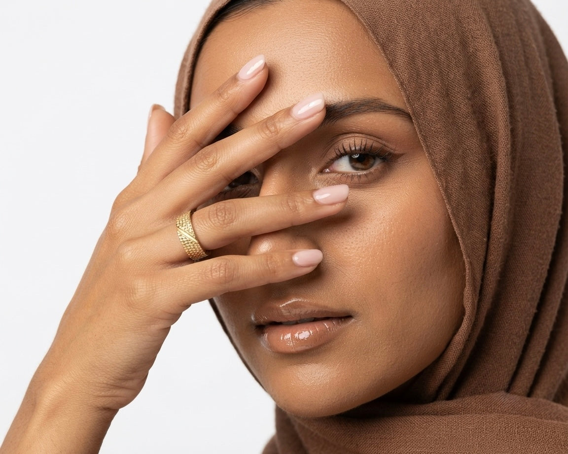 Woman wearing Avani Virsa 18K Gold Textured Ring On Her Index Finger.